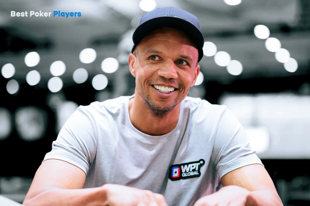 Portrait of Phil Ivey smiling in casual setting with blurred background